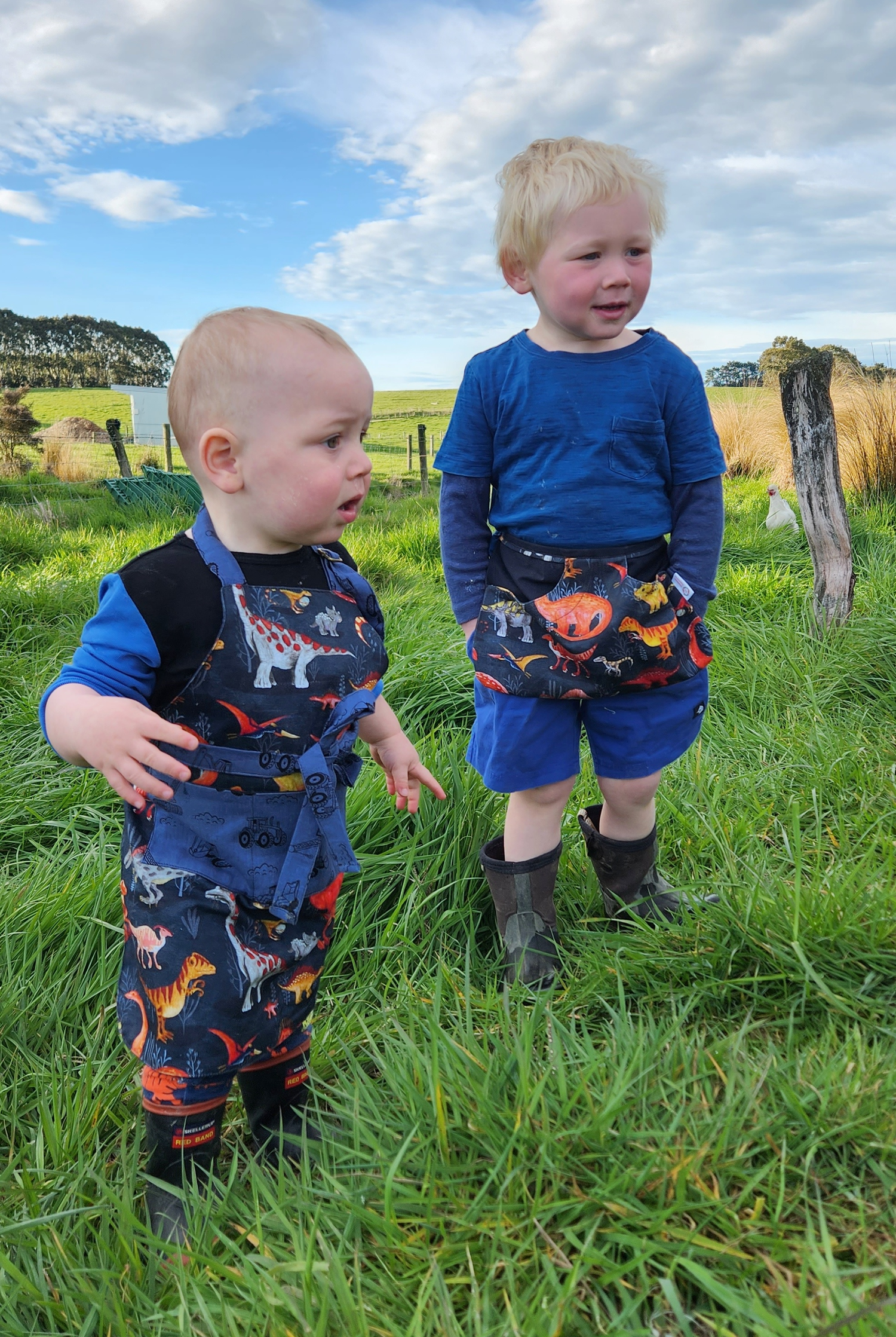 two children wearing aprons