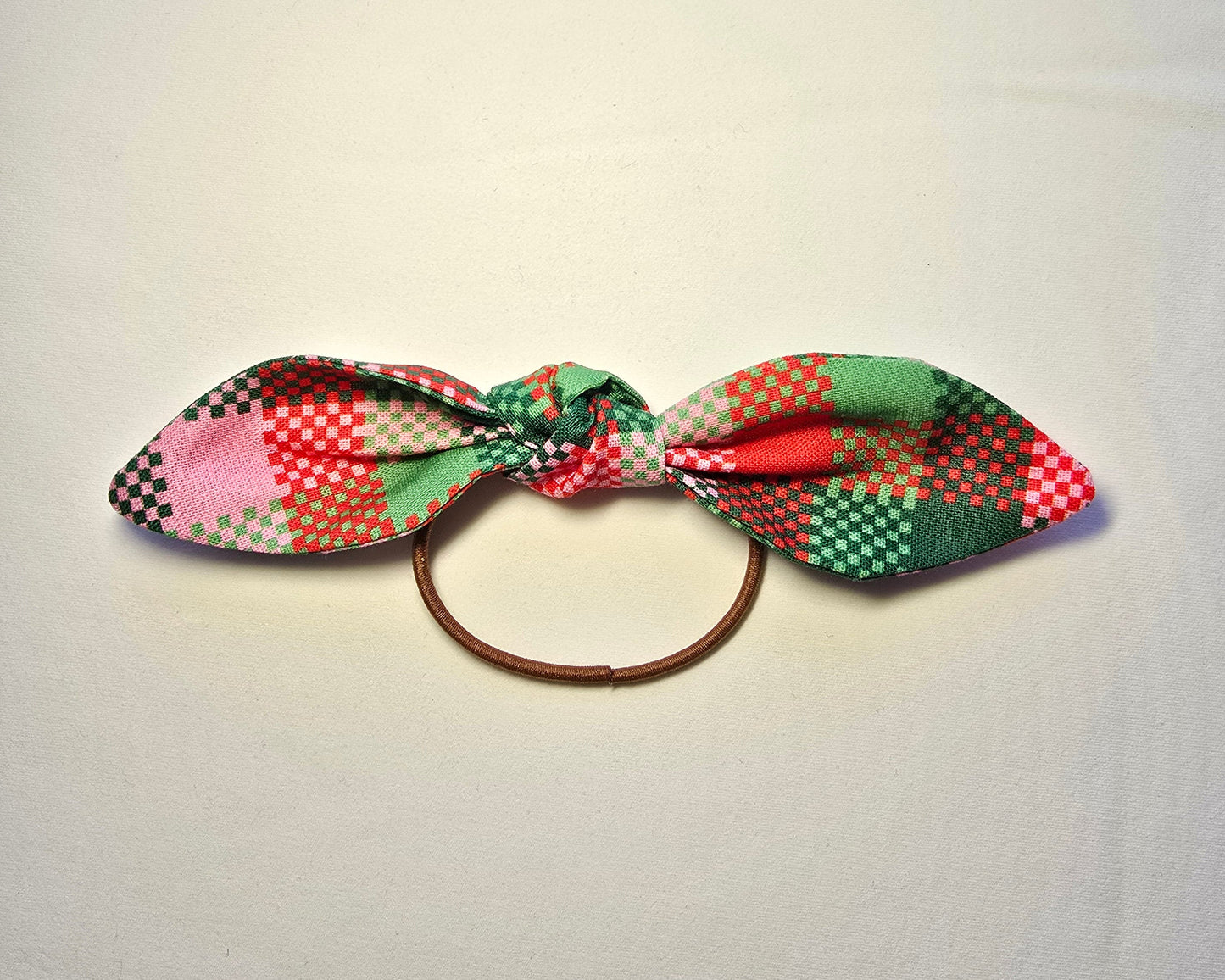 Plaid hair tie on a white background
